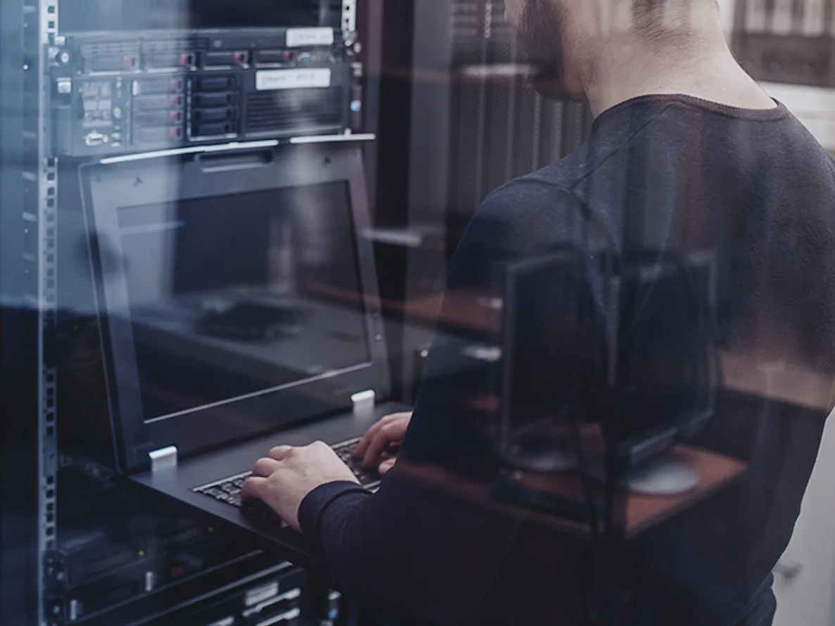 Man using a computer in a Disaster Recovery as a Service (DRaaS) facility.